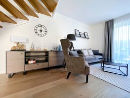 Wohnraum mit Sideboard, Sofa, Sessel und Glastisch im Ostsee-Domizil Ferienhaus Hohwacht